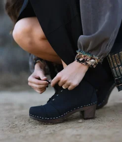 Chukka cap toe clog boots