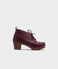 Chukka cap toe clog boots