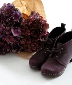 Chukka cap toe clog boots