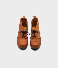 Chukka cap toe clog boots