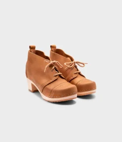 Chukka cap toe clog boots