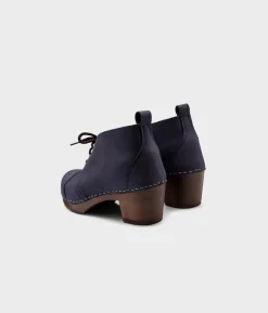 Chukka cap toe clog boots
