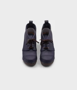 Chukka cap toe clog boots