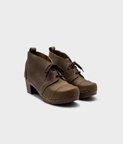Chukka cap toe clog boots