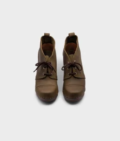 Chukka cap toe clog boots